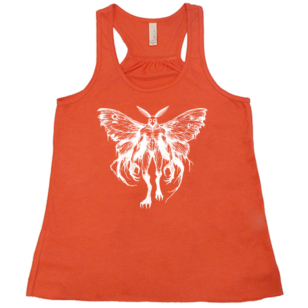 Coral colored flowy tank with detailed mothman graphic on it