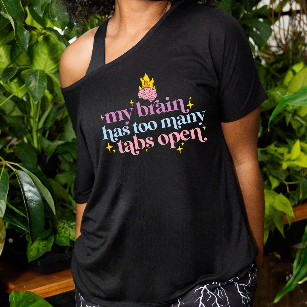 black slouchy shirt with a flaming brain graphic on it that says "My Brain Has Too Many Tabs Open"