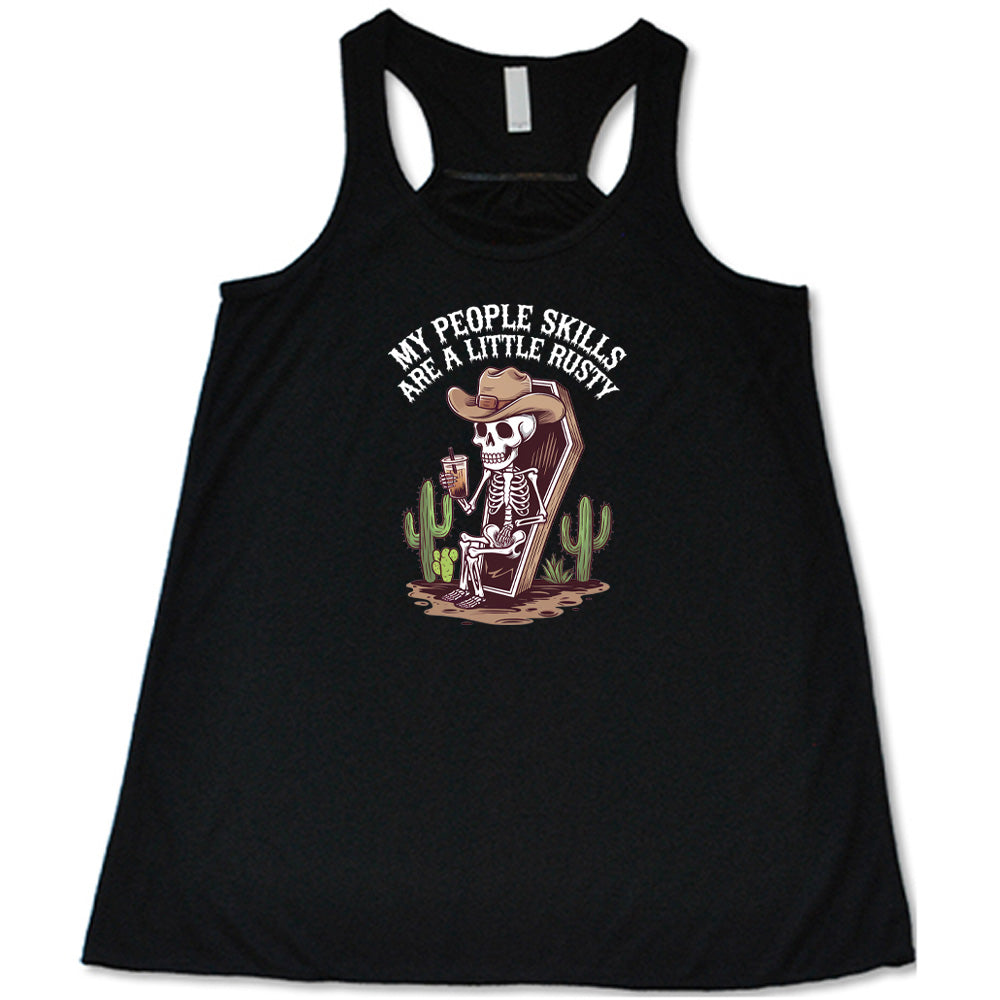 Black colored flowy tank with a skeleton sitting in a coffin graphic on it that says "My People Skills Are A Little Rusty"