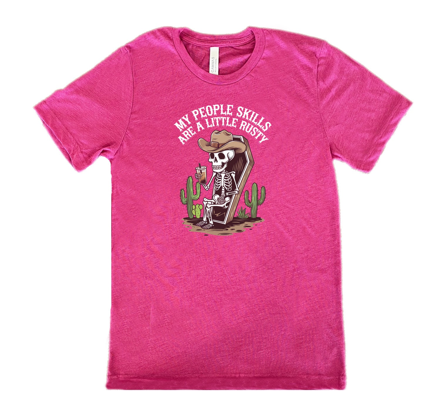 Berry colored shirt with a skeleton sitting in a coffin graphic on it that says "My People Skills Are A Little Rusty"