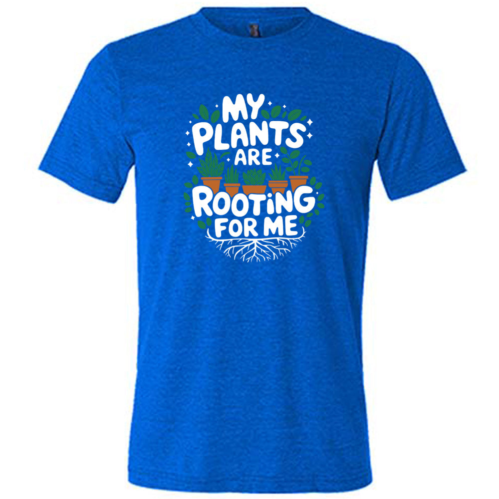 Blue colored shirt with a potted plants and roots graphic on it that says "My Plants Are Rooting For Me"