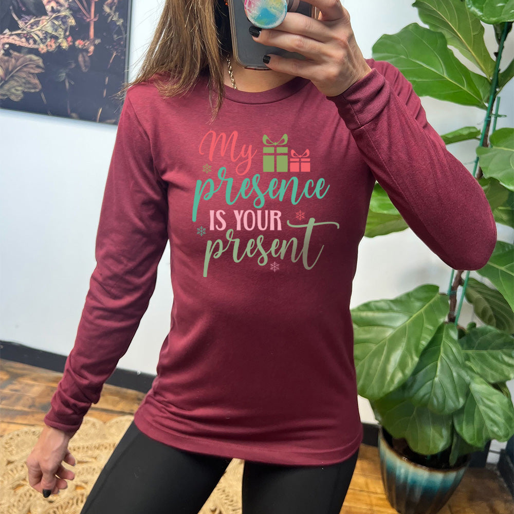 heather cardinal long sleeve with the words "my presence is your present" with two little present images