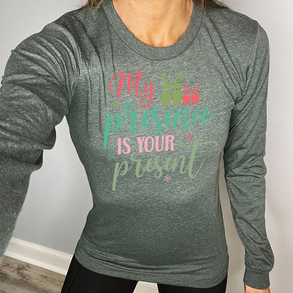 heather forest long sleeve with the words "my presence is your present" with two little present images