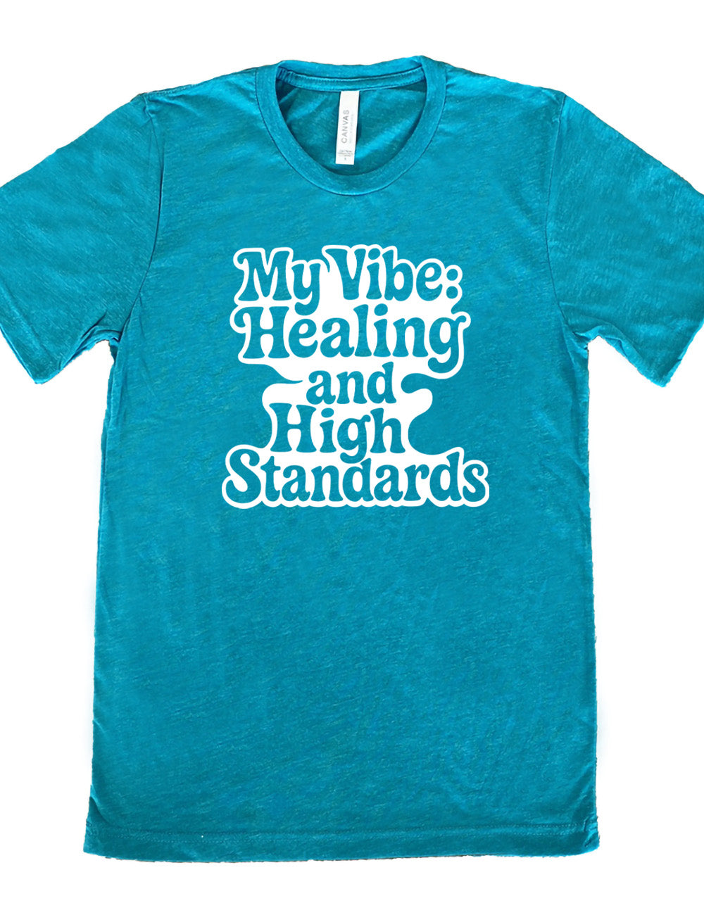 teal unisex tee with the words "my vibe: healing and high standards" on it