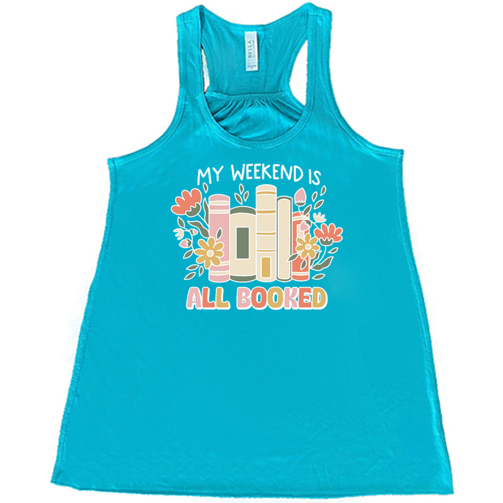 Teal colored flowy tank with books and flowers graphic on it that says "My Weekend Is All Booked"