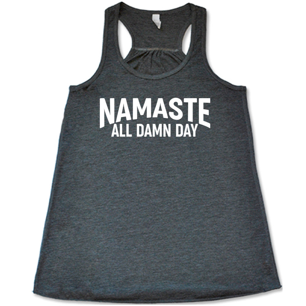grey flowy tank with the words "Namaste all damn day" on it