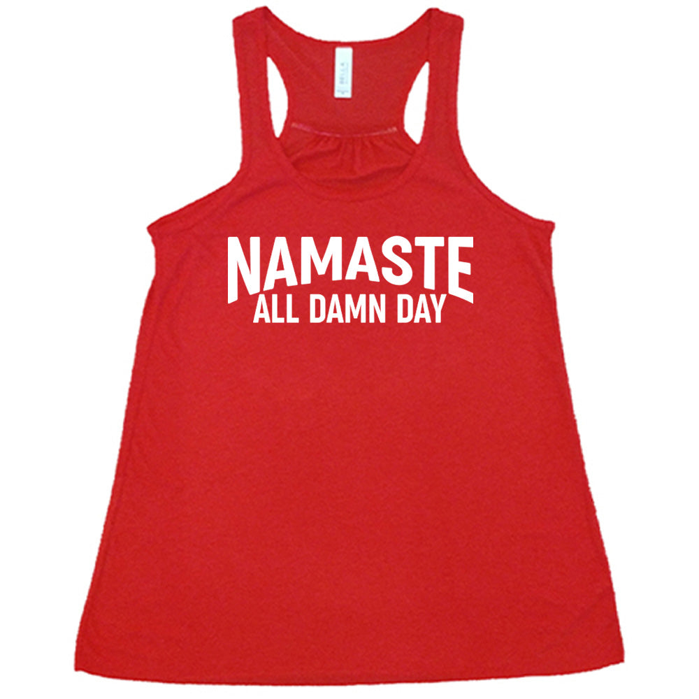 red flowy tank with the words "Namaste all damn day" on it