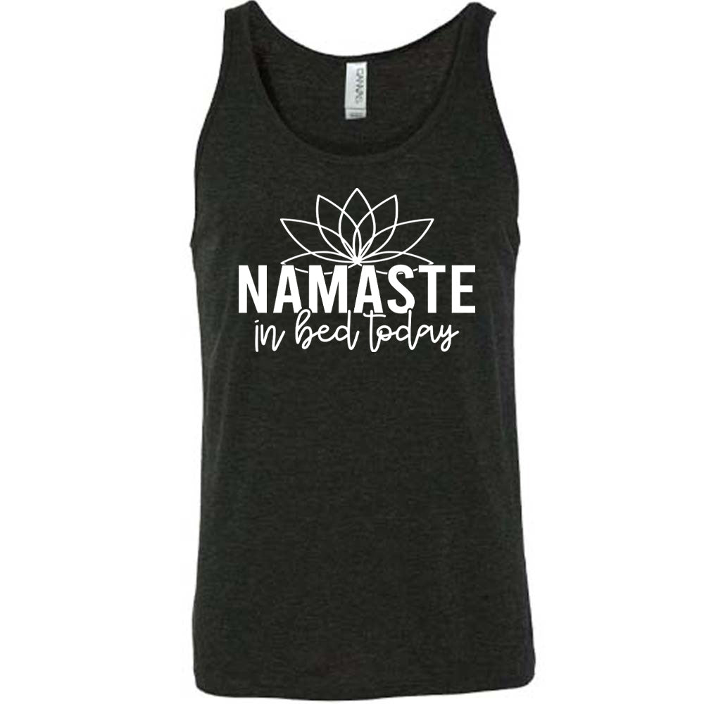 Black unisex tank with the words "Namaste in bed today" with a line art of a lotus flower above it