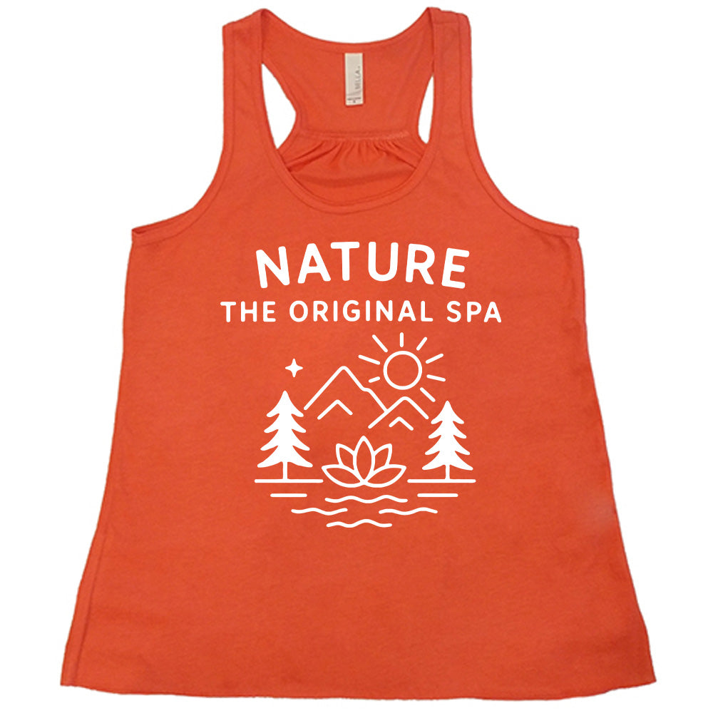coral flowy tank with the words "nature the original spa" on it, with the mostly line-art graphic of the sun, mountains, trees, a single star, water, and a lotus flower