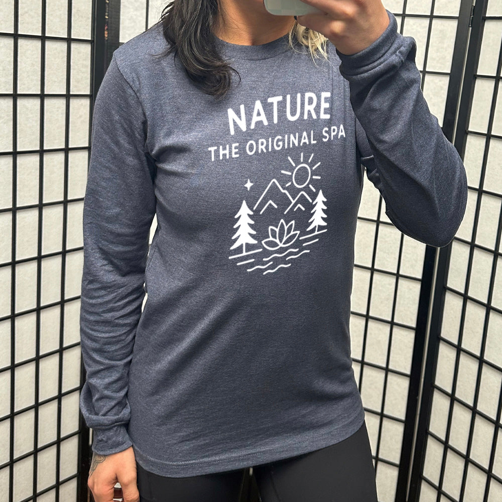 heather navy long sleeve with the words "nature the original spa" on it, with the mostly line-art graphic of the sun, mountains, trees, a single star, water, and a lotus flower