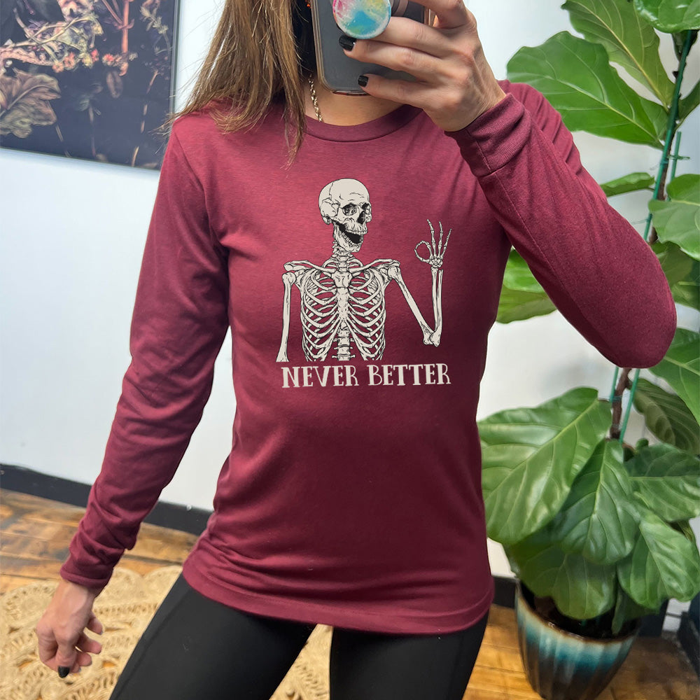 heather cardinal long sleeve shirt with the text "Never Better" and a skeleton graphic on it