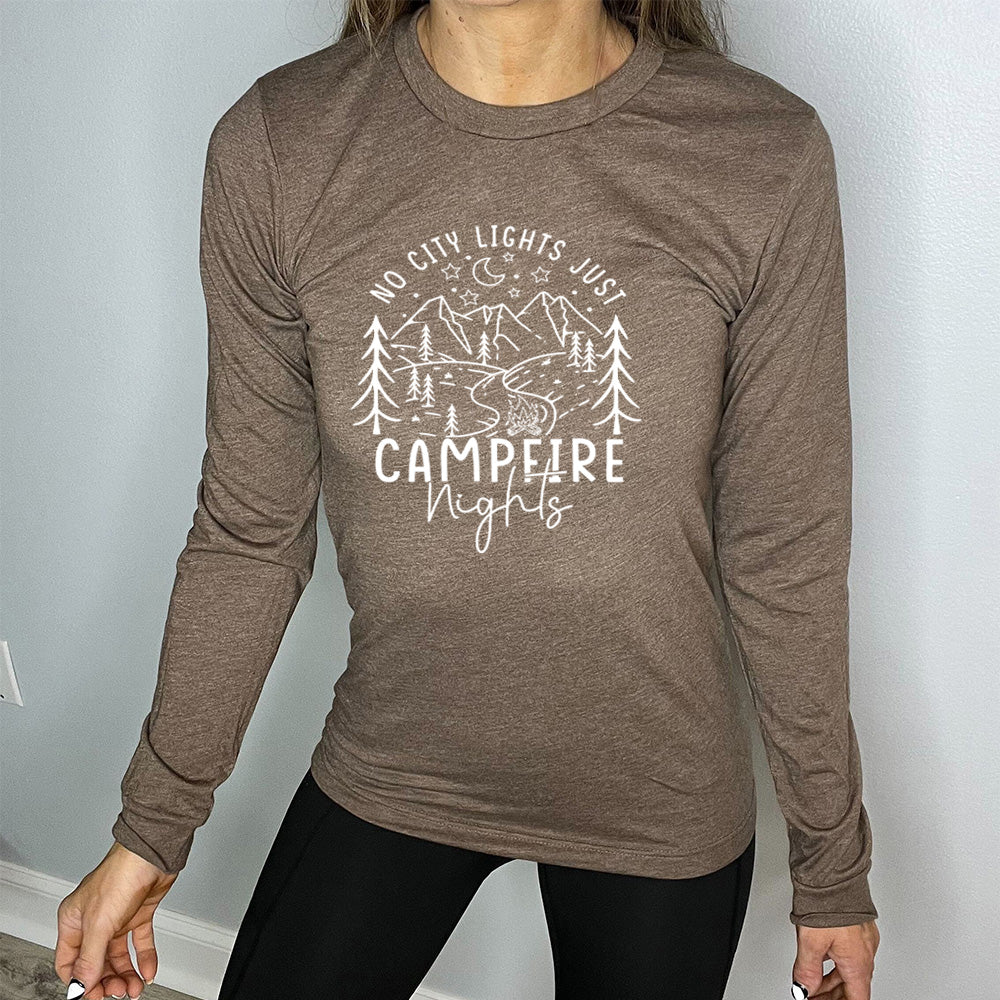 Brown colored long sleeve shirt with a stars and mountain graphic on it that says "No City Lights Just Campfire Nights"