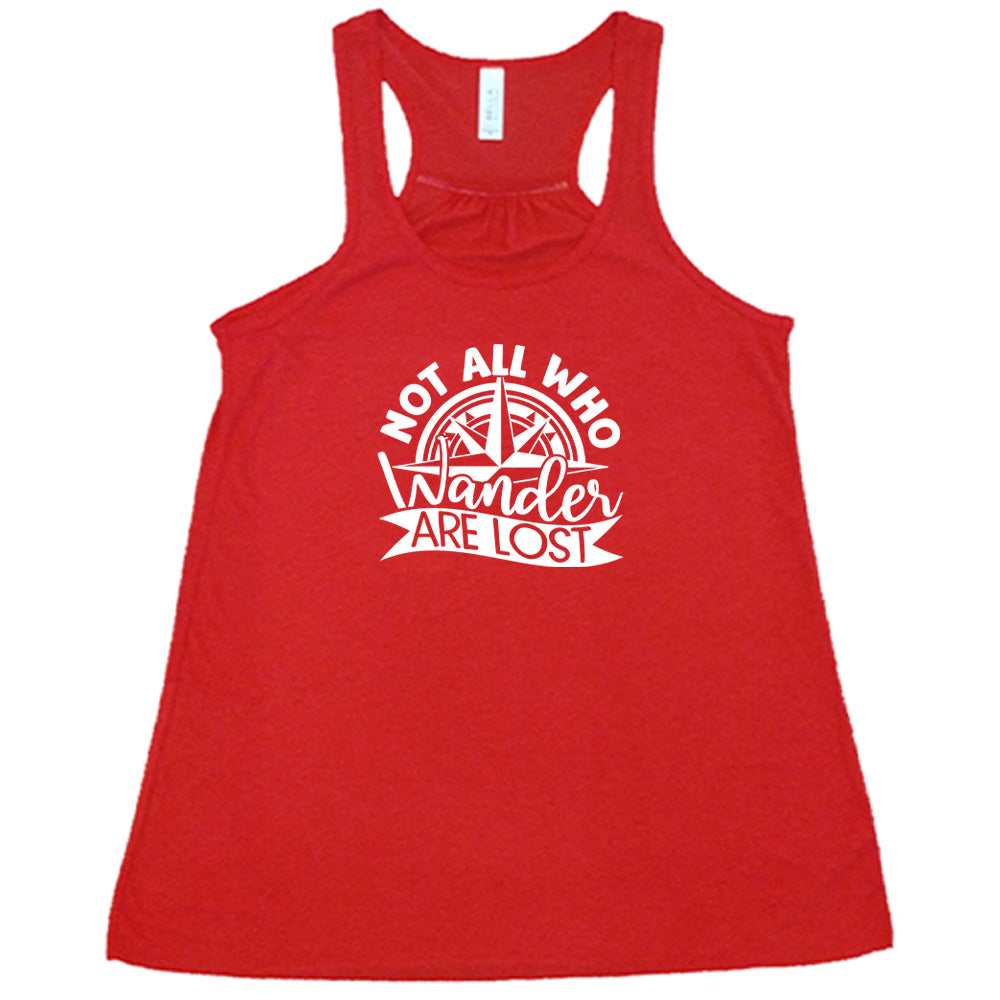Red colored flowy tank with a compass graphic on it that says "Not All Who Wander Are Lost"