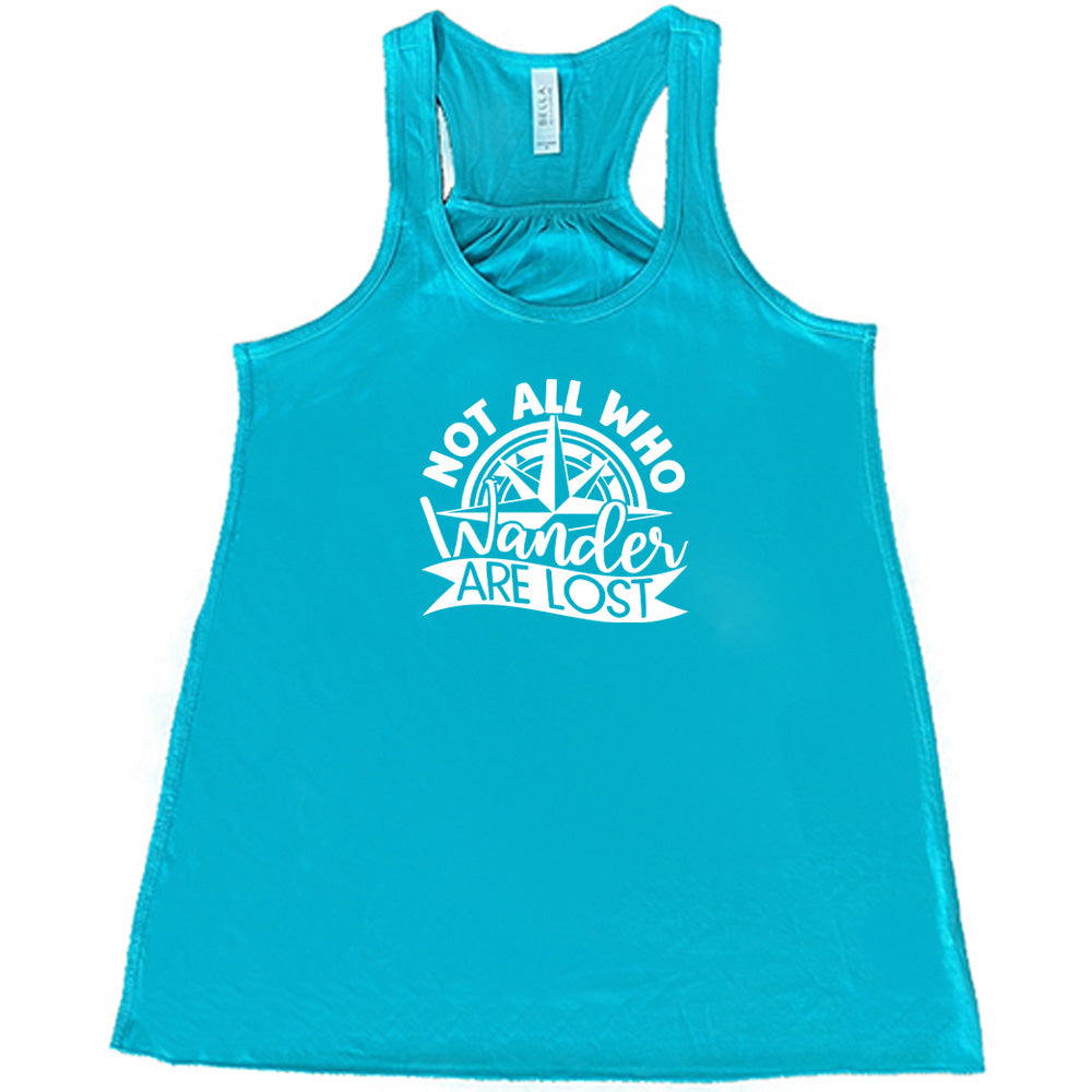 Teal colored flowy tank with a compass graphic on it that says "Not All Who Wander Are Lost"
