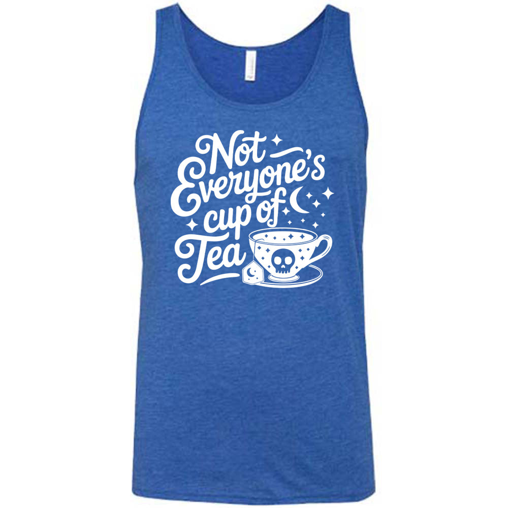 blue unisex tank with the words "not everyone's cup of a tea" in a cursive font, with the graphics of a moon and little stars, and a tea cup with a skull on it with stars and the tea bag has a moon on it