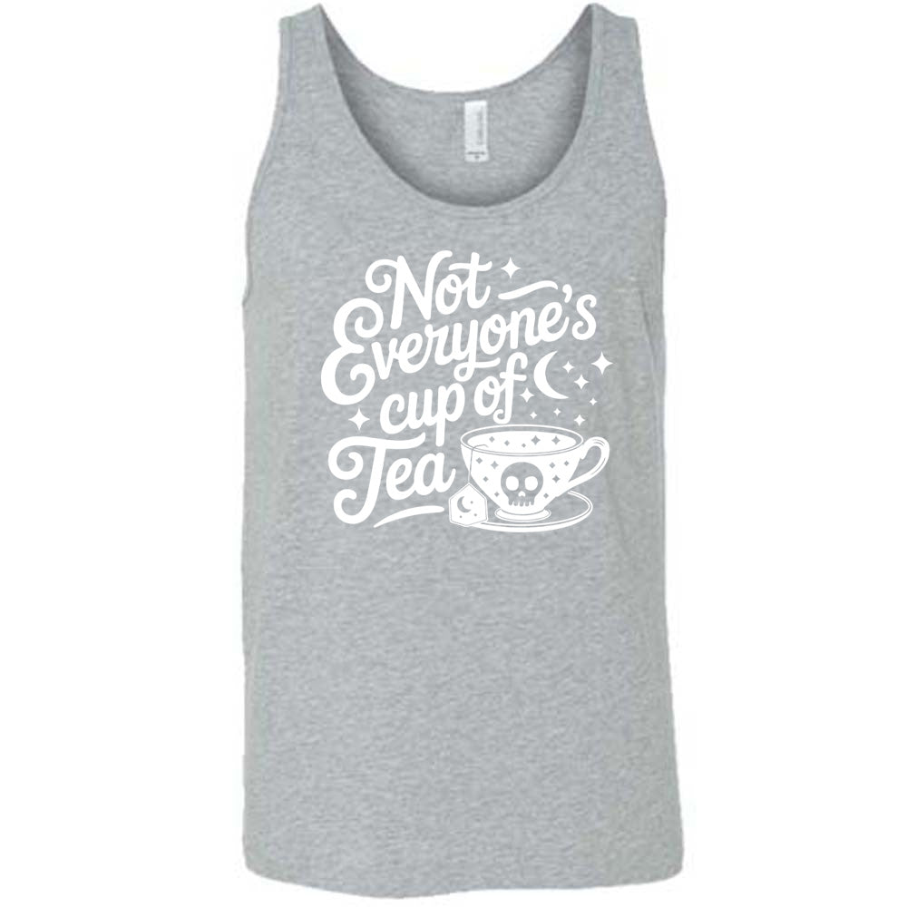 grey unisex tank with the words "not everyone's cup of a tea" in a cursive font, with the graphics of a moon and little stars, and a tea cup with a skull on it with stars and the tea bag has a moon on it