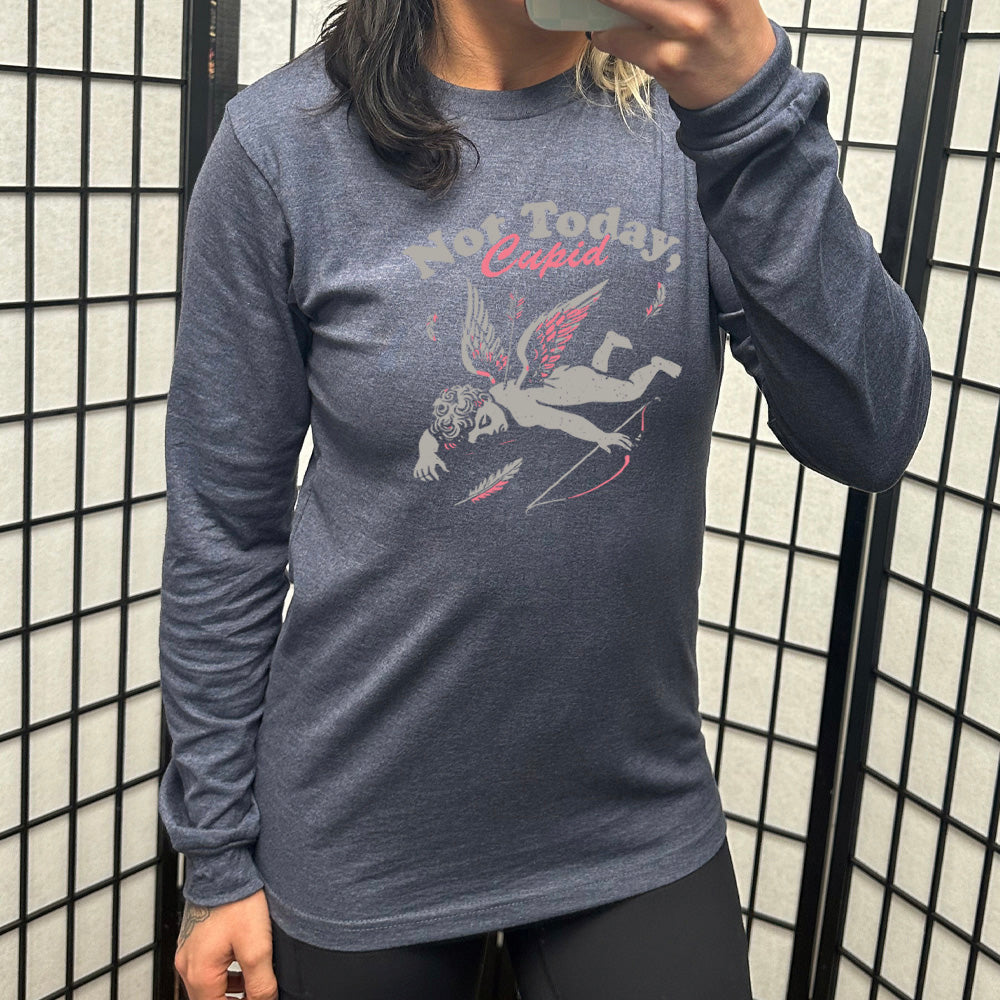 heather navy long sleeve shirt with the words "not today, Cupid" on it, with the graphic of cupid, presumably dead, lying on the ground, bow at his side, with an arrow through his back