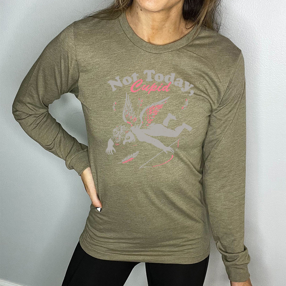 heather olive long sleeve shirt with the words "not today, Cupid" on it, with the graphic of cupid, presumably dead, lying on the ground, bow at his side, with an arrow through his back