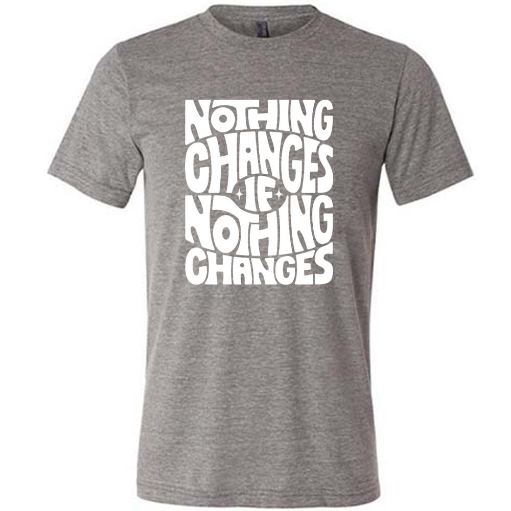 grey unisex tee with the words "nothing changes if nothing changes" on it, with two tiny stars on either side of the word "if"