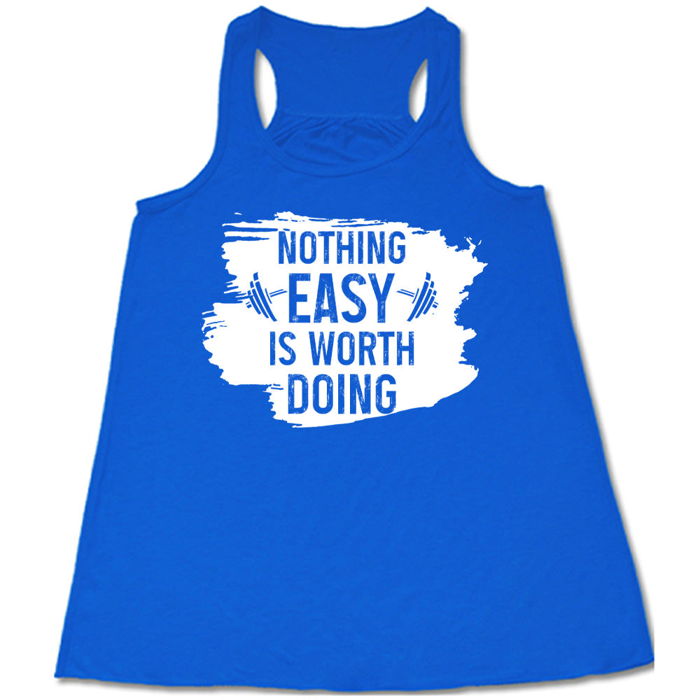 Blue Flowy Tank, with wording Nothing Easy is Worth Doing, lettering is color of shirt with barbells all over a white patch