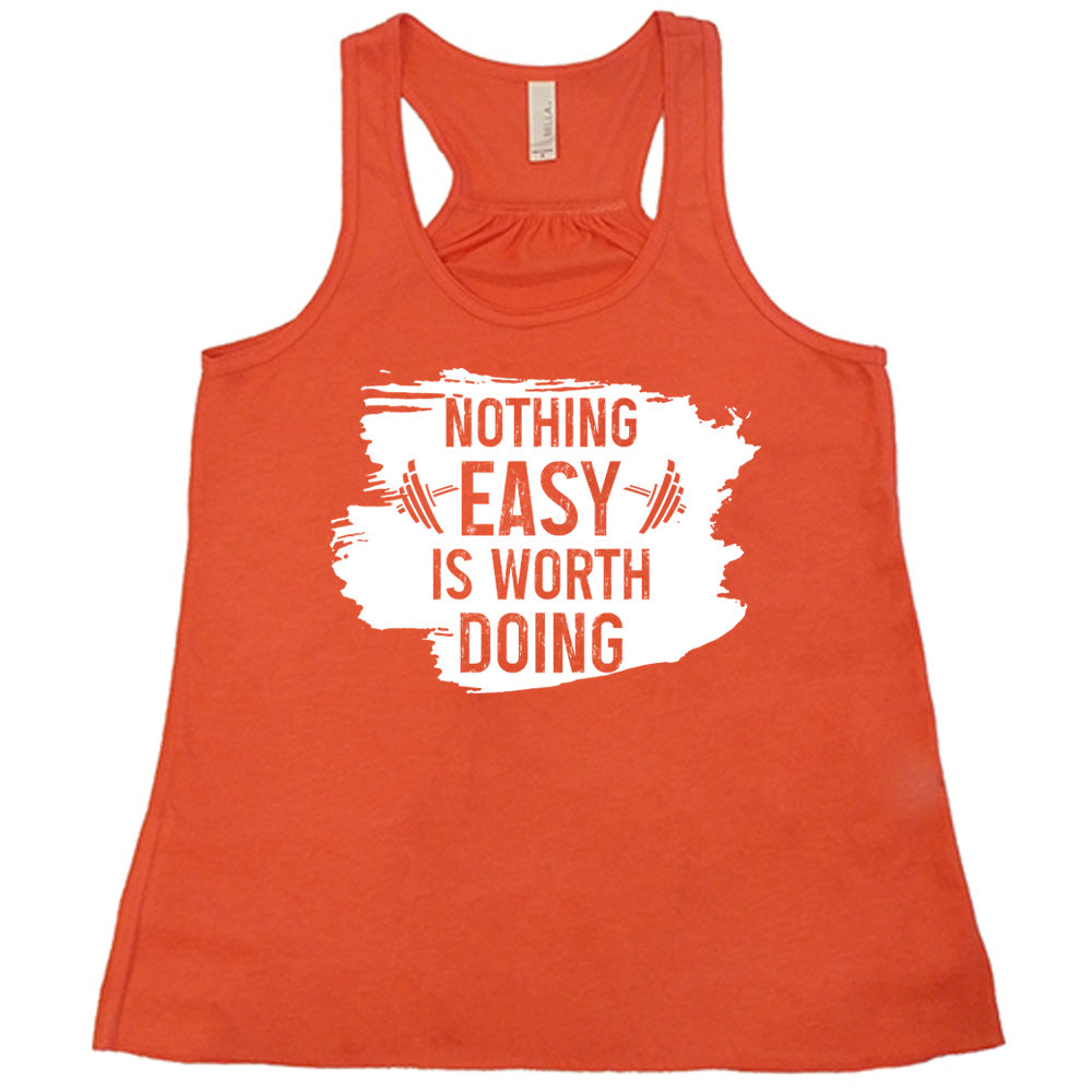 Coral Flowy Tank, with wording Nothing Easy is Worth Doing, lettering is color of shirt with barbells all over a white patch