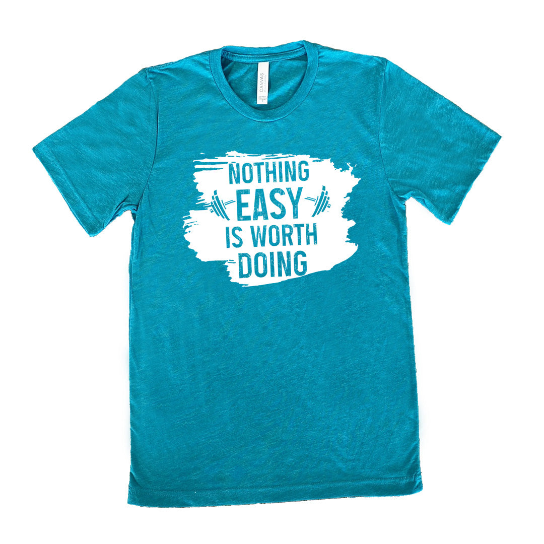 Teal Unisex Tee, with wording Nothing Easy is Worth Doing, lettering is color of shirt with barbells all over a white patch