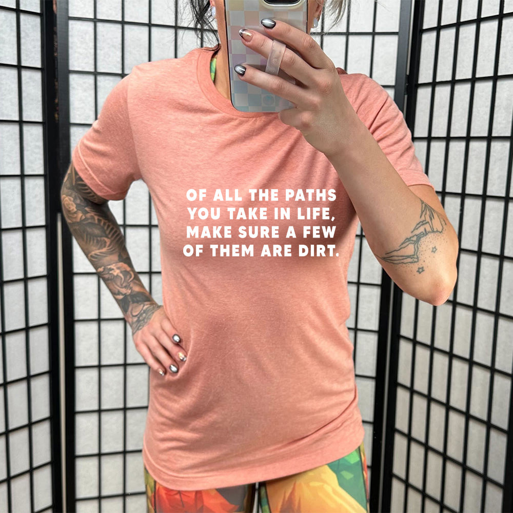 peach shirt with a forest graphic on it that says "Of All The Paths You Take In Life, Make Sure A Few Of Them Are Dirt"