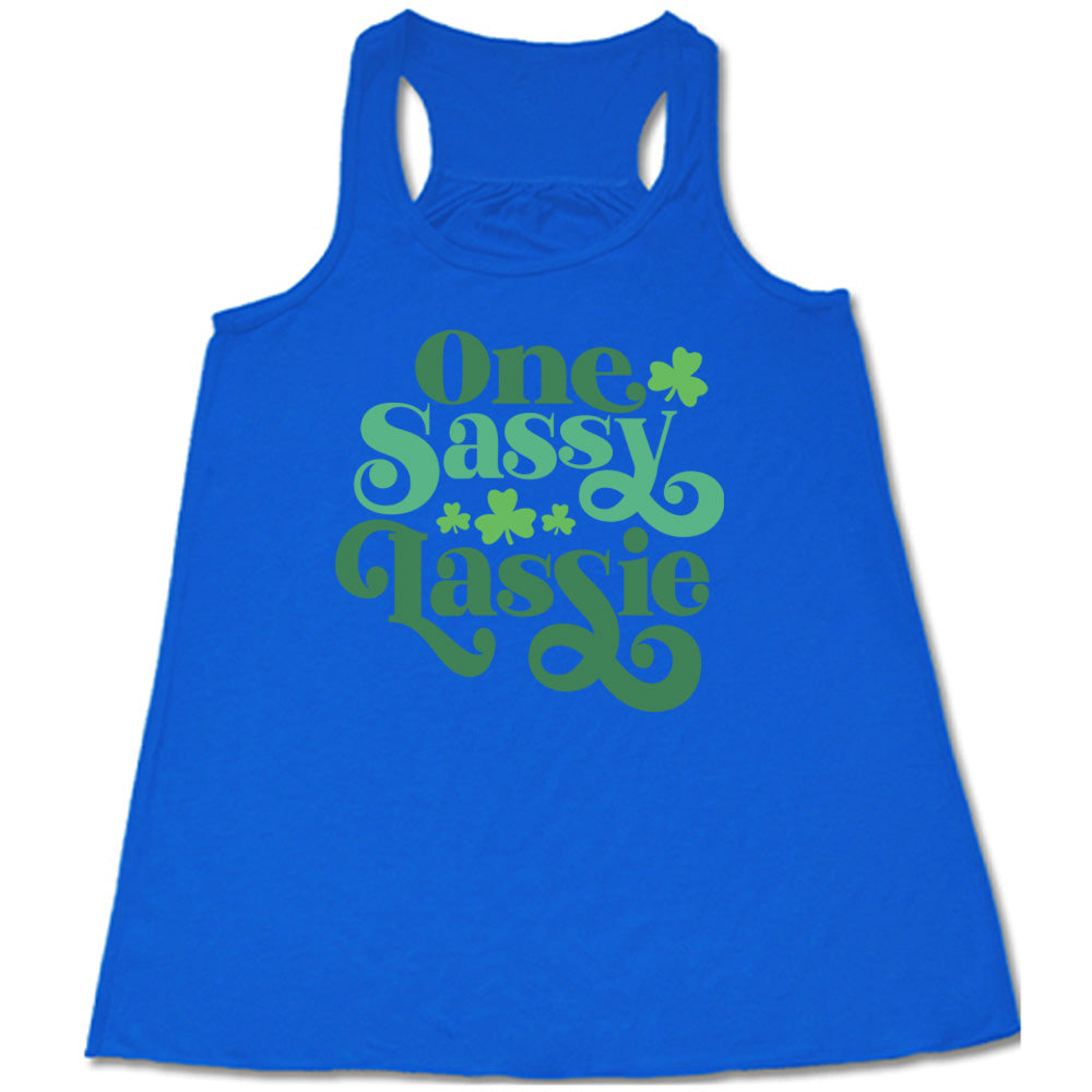 blue flowy tank with the words "one sassy lassie" on it, with a few shamrock graphics
