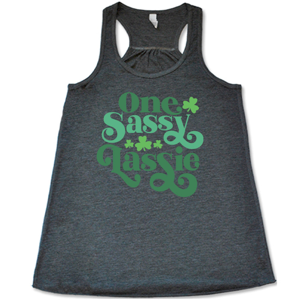 grey flowy tank with the words "one sassy lassie" on it, with a few shamrock graphics