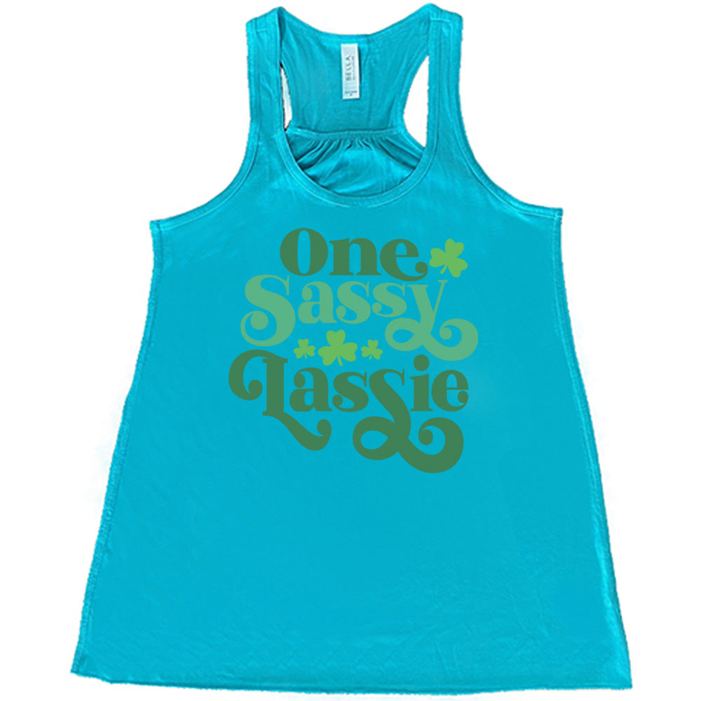 teal flowy tank with the words "one sassy lassie" on it, with a few shamrock graphics