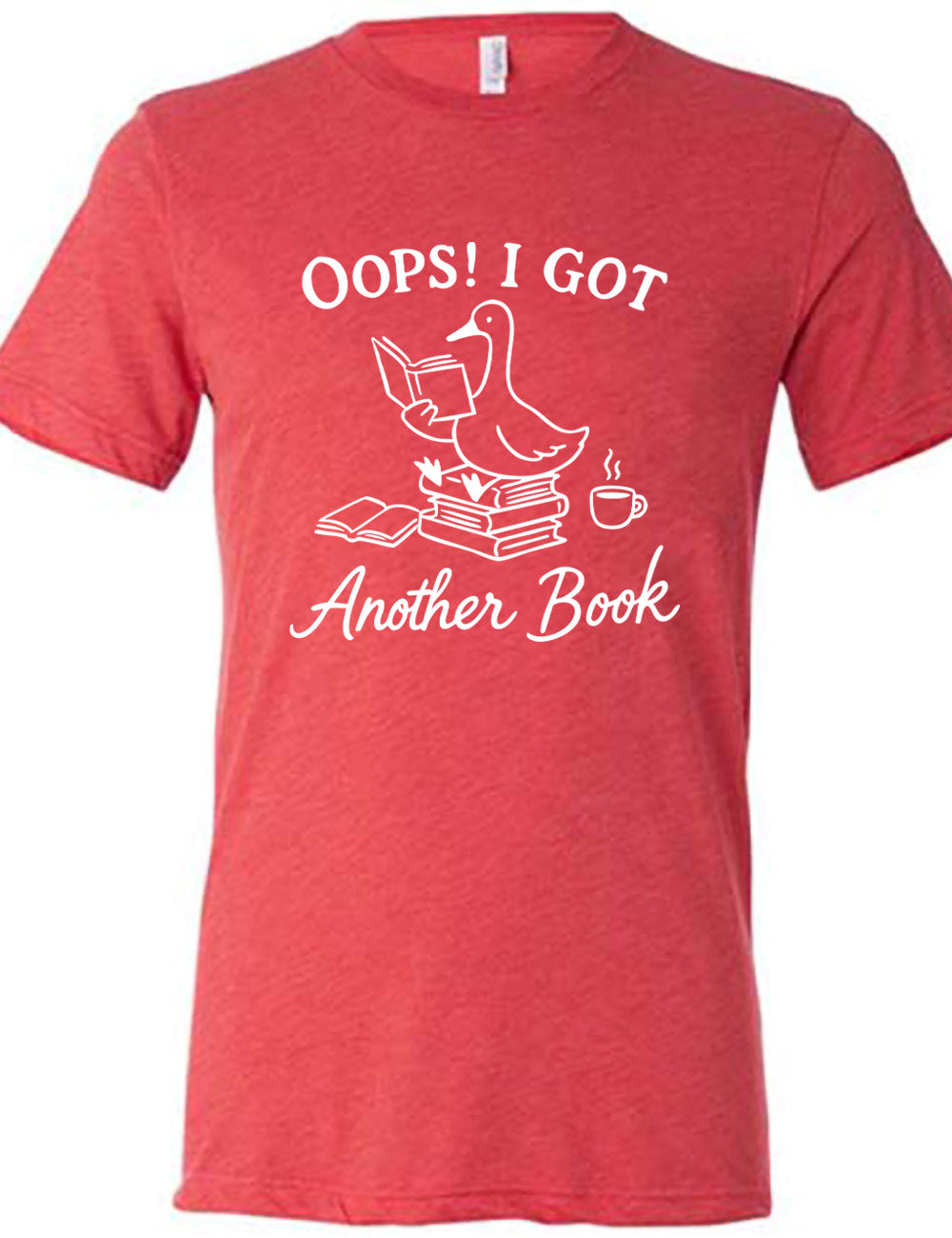 red unisex tee with the graphic of a goose, sitting on a stack of books, reading a book, with another book open beside the stack, and a steaming cup of coffee on the other side, with the words around the graphic saying "Oops! I got another book"