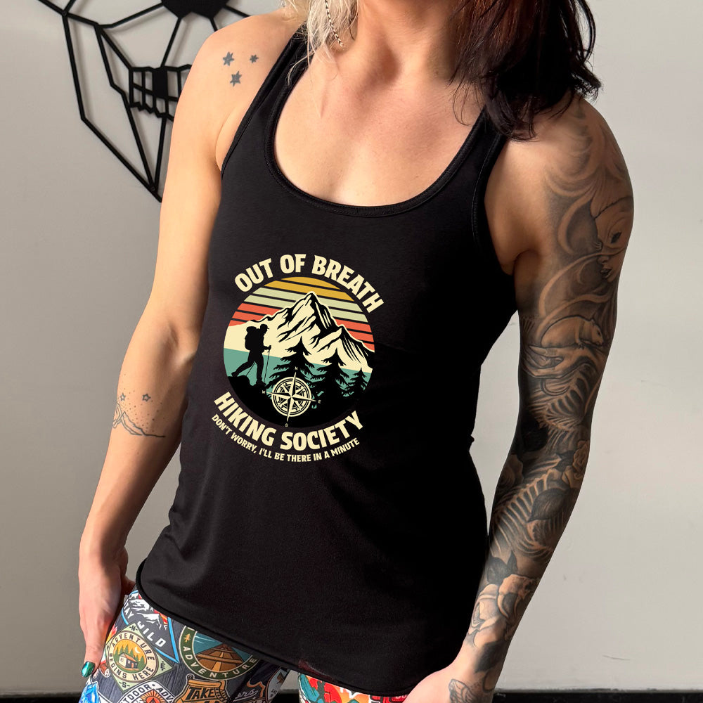 Black colored flowy tank with a Hiker and mountain graphic on it that says "Out Of Breath Hiking Society"