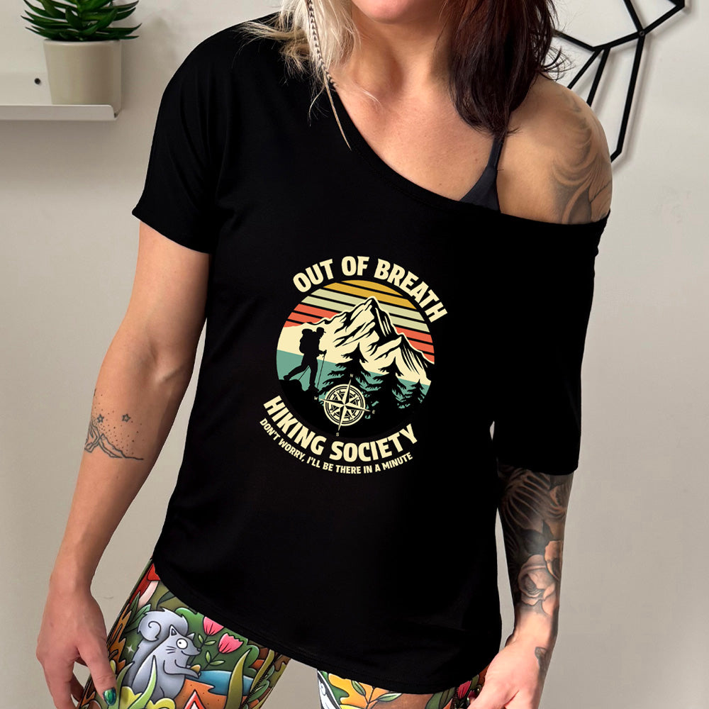 black slouchy shirt with a Hiker and mountain graphic on it that says "Out Of Breath Hiking Society"