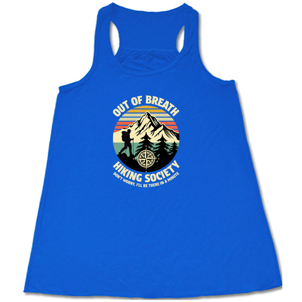 Blue colored flowy tank with a Hiker and mountain graphic on it that says "Out Of Breath Hiking Society"