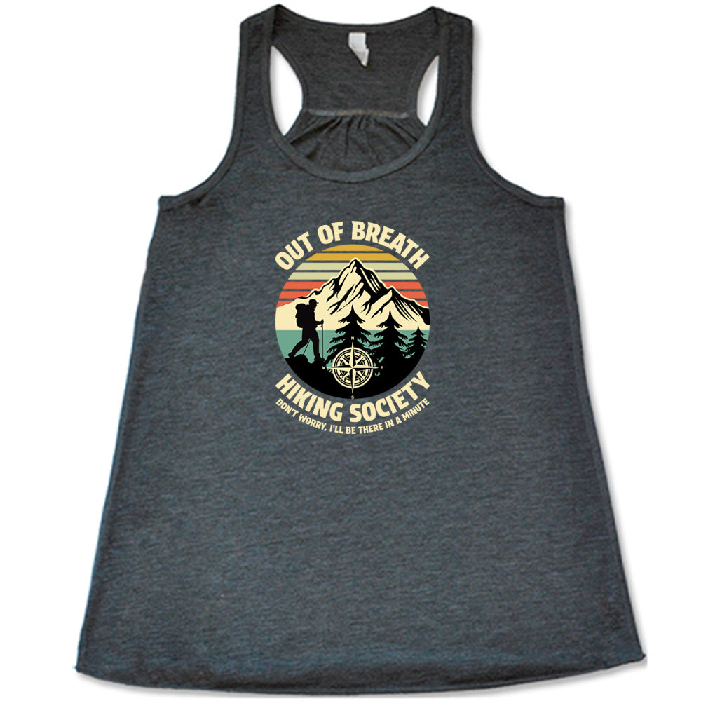 Grey colored flowy tank with a Hiker and mountain graphic on it that says "Out Of Breath Hiking Society"