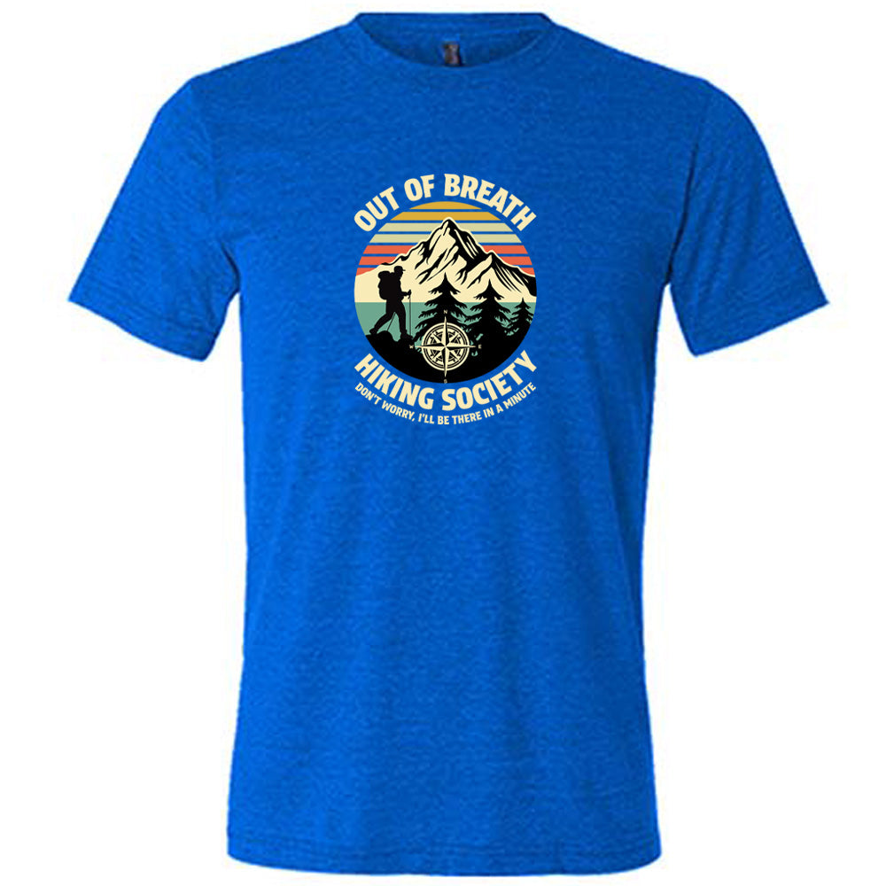 Blue colored shirt with a hiker and mountain graphic on it that says "Out Of Breath Hiking Society"