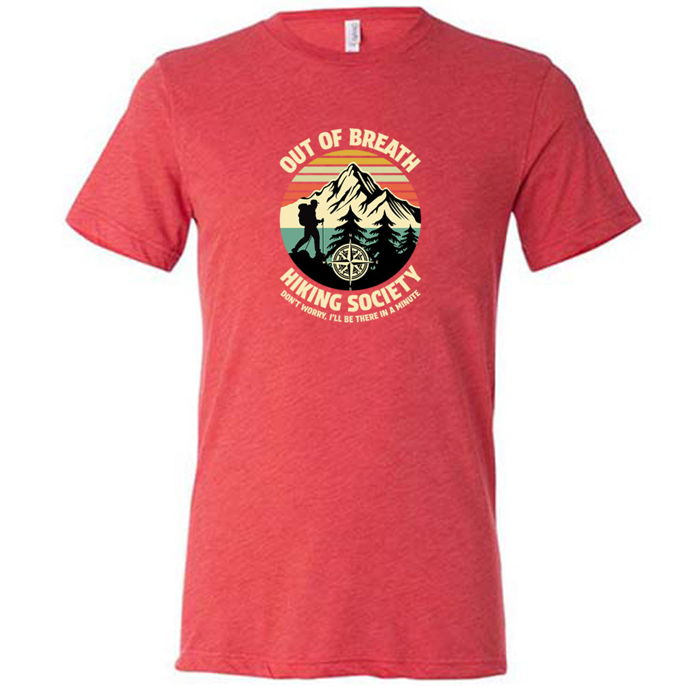 Red colored shirt with a hiker and mountain graphic on it that says "Out Of Breath Hiking Society"