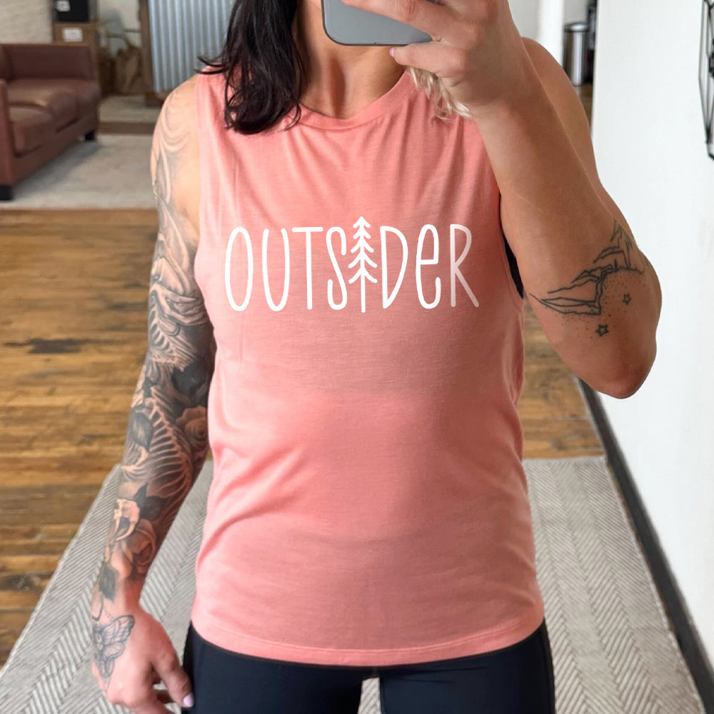 peach muscle tank with a tree graphic on it that says "Outsider"