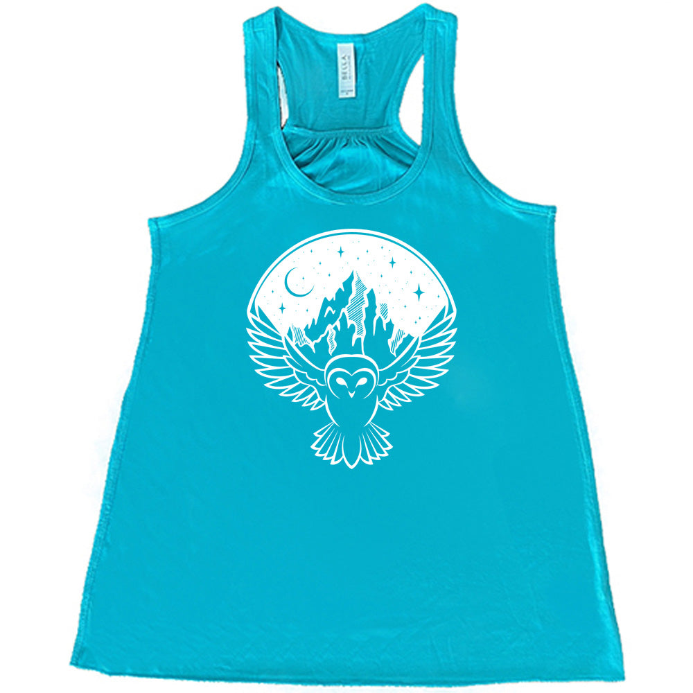 Teal colored flowy tank with night sky owl and mountain graphic on it
