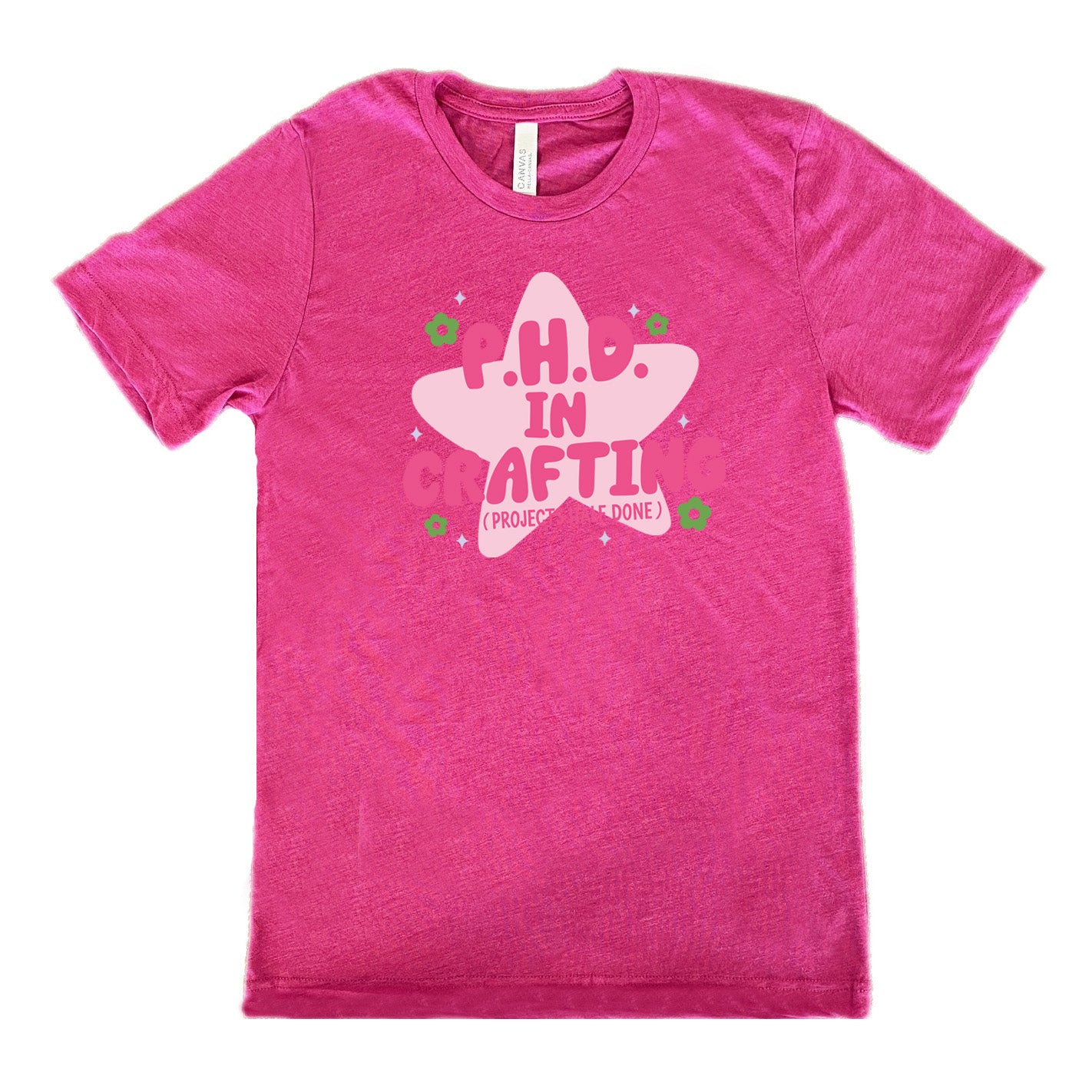 berry unisex tee with cartoon graphic of a large star behind the words "P.H.D. in Crafting" in large font with the words (Projects Half Done) in small font underneath, with very small flowers and stars around