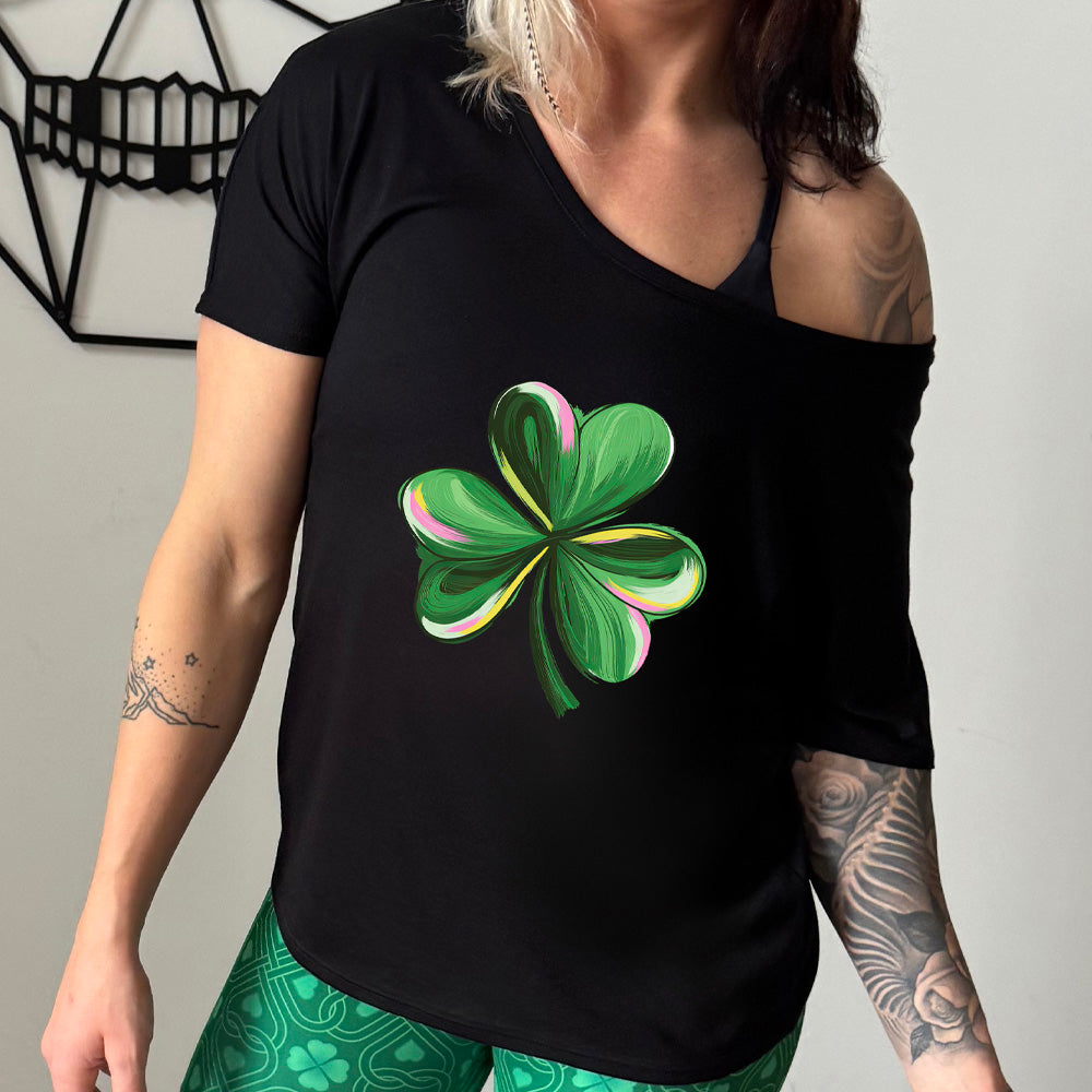 shirt with a painted shamrock graphic on it