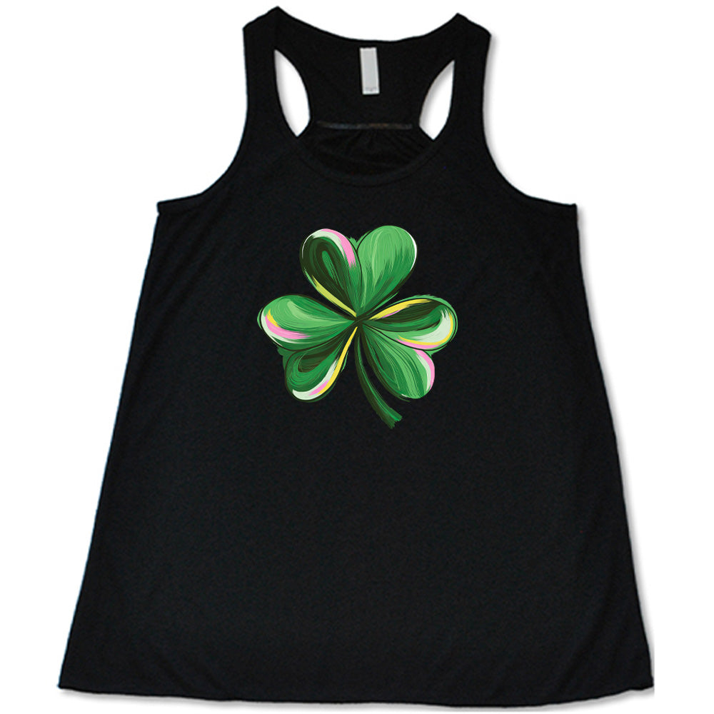 black shirt with a painted shamrock graphic on it