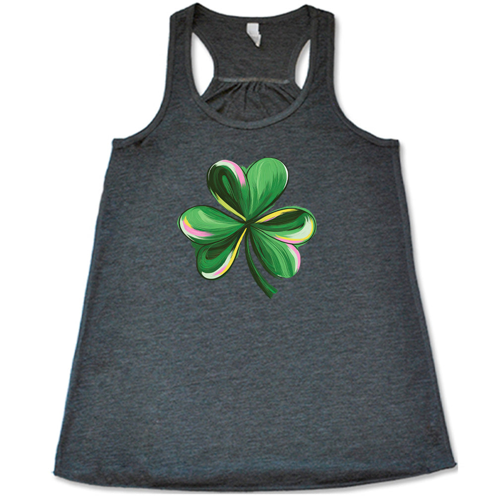 grey shirt with a painted shamrock graphic on it