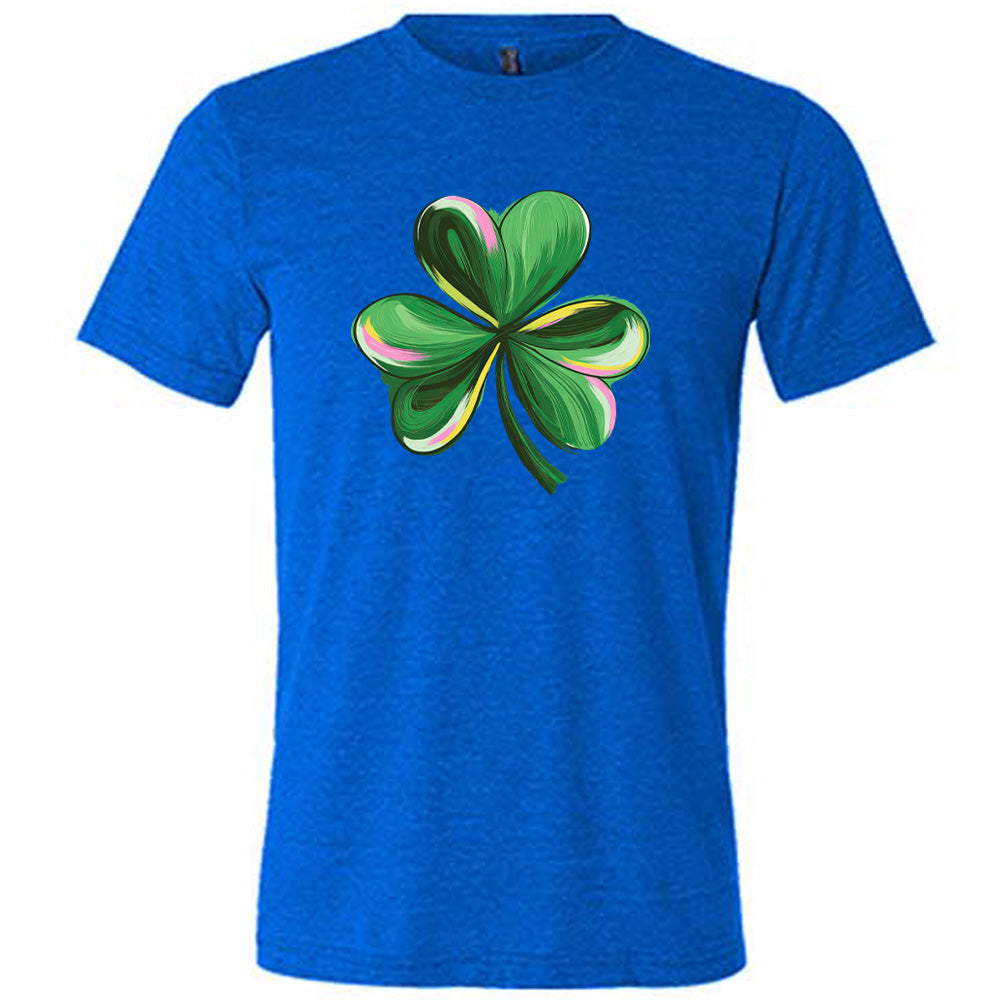 blue shirt with a painted shamrock graphic on it