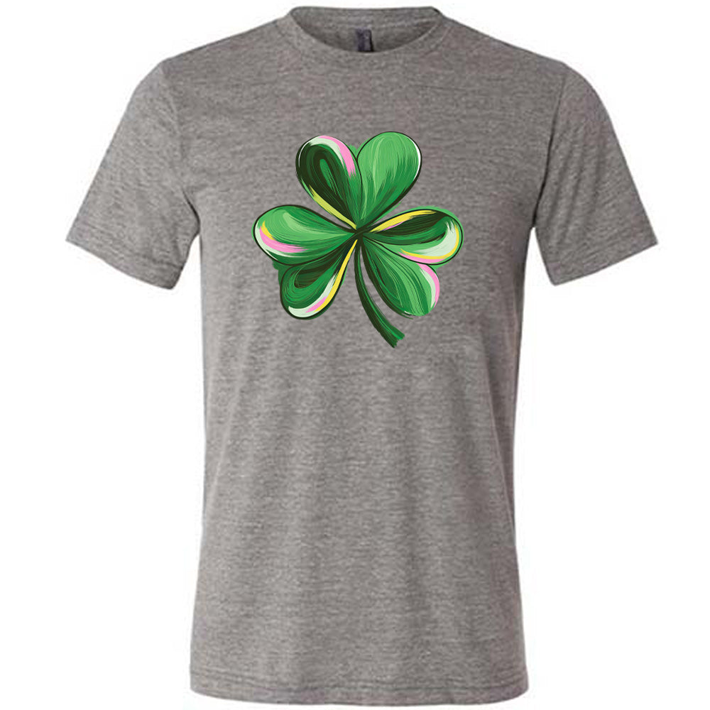 grey shirt with a painted shamrock graphic on it