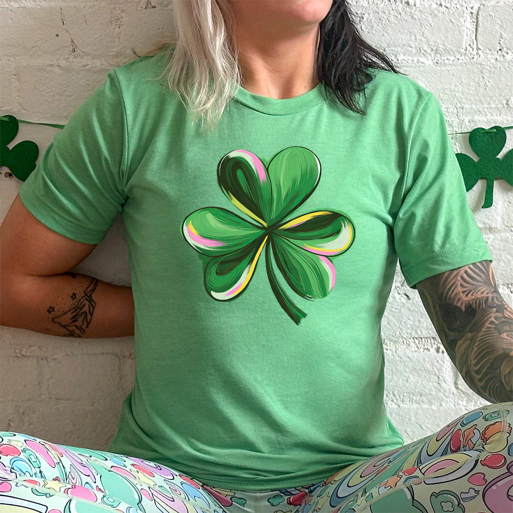 green shirt with a painted shamrock graphic on it