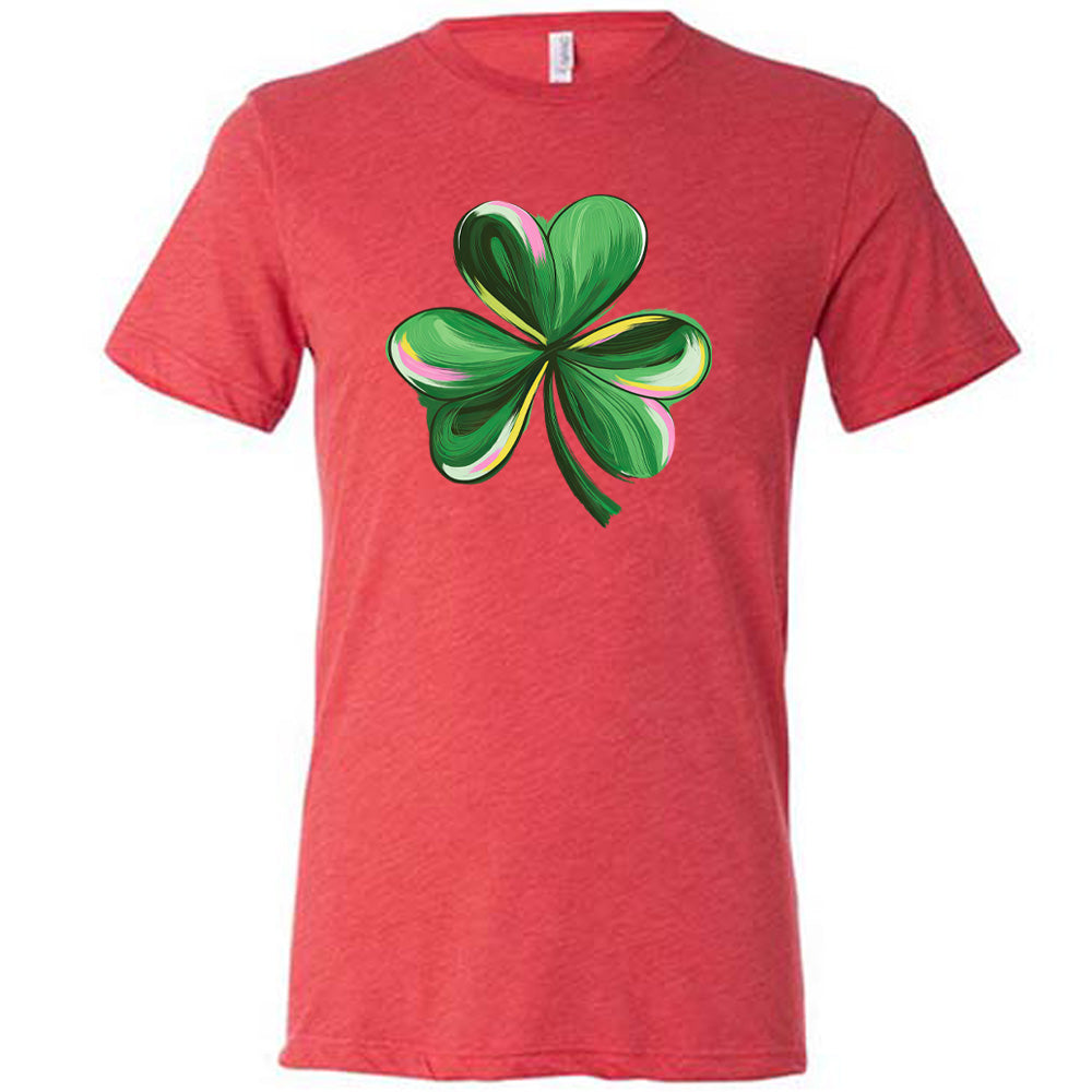 red shirt with a painted shamrock graphic on it