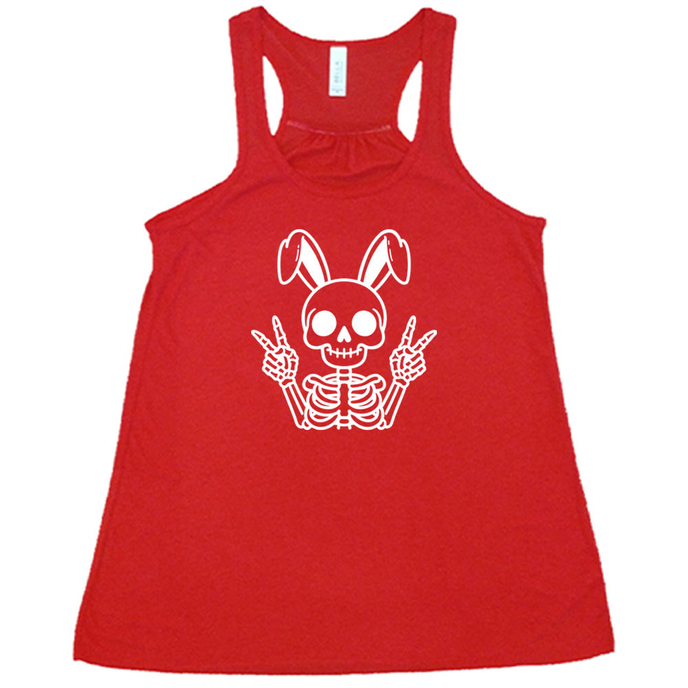 Red colored flowy tank with a skeleton bunny doing a peace sign graphic on it