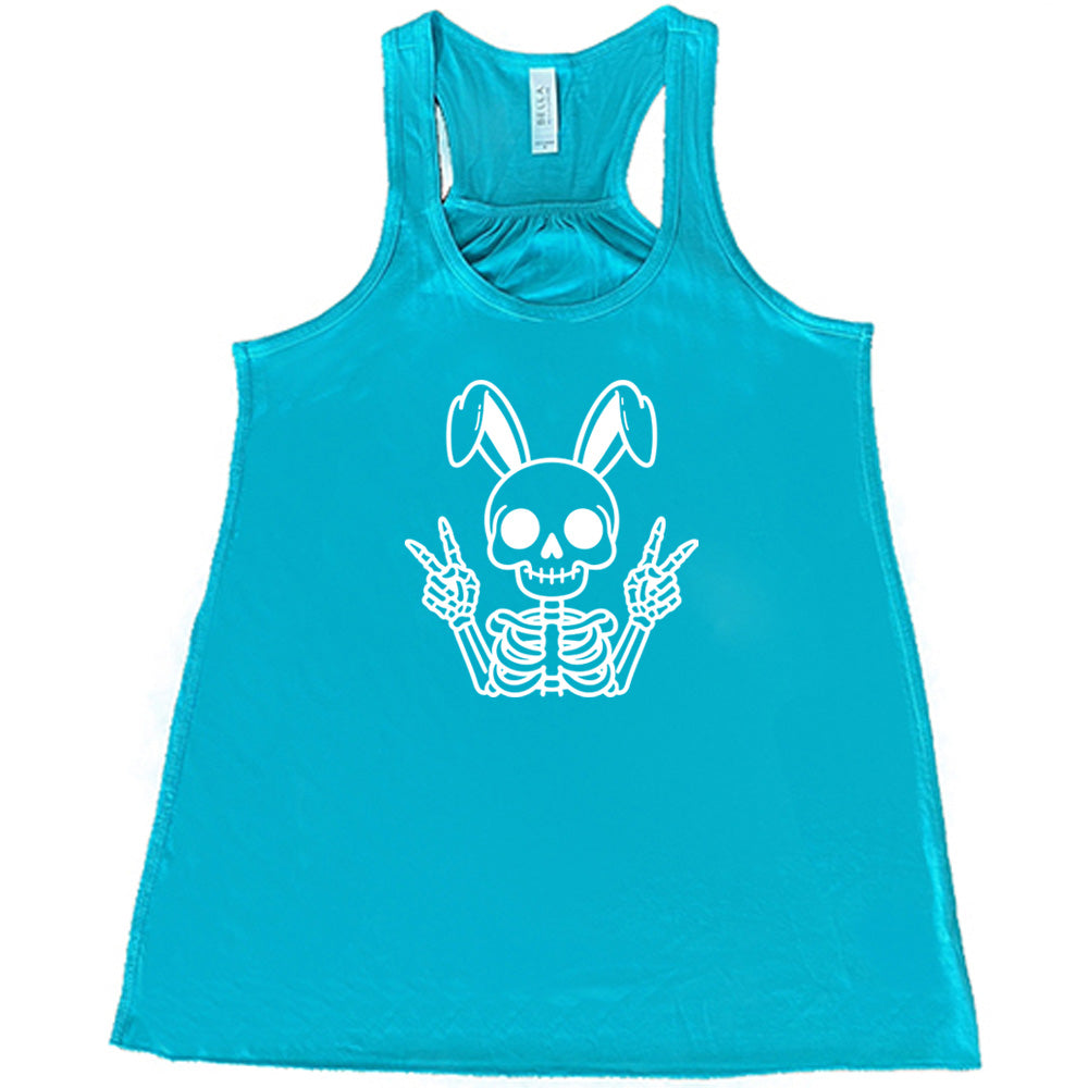 Teal colored flowy tank with a skeleton bunny doing a peace sign graphic on it