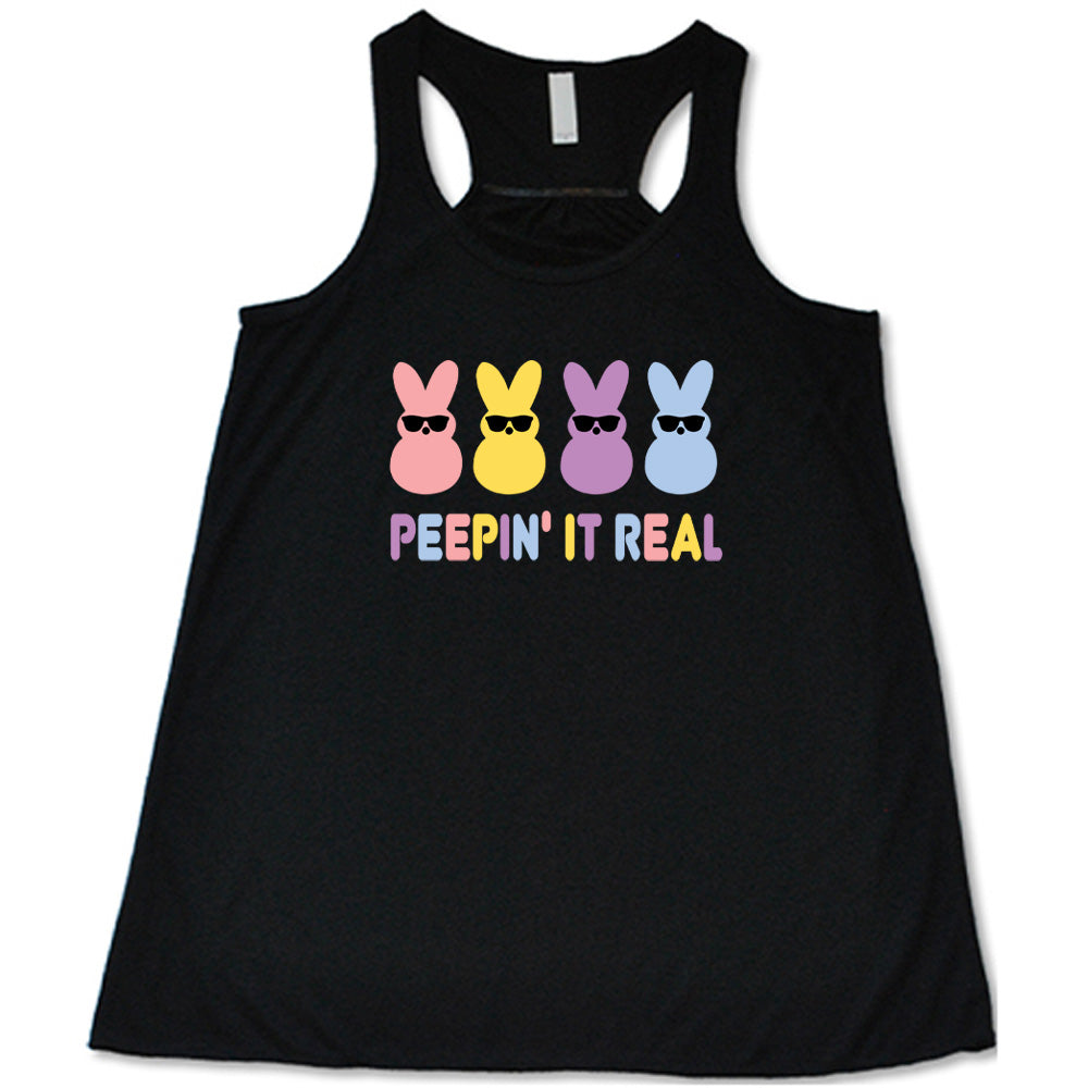 Black colored flowy tank with an Easter-colored bunnies graphic on it that says "Peepin it Real"